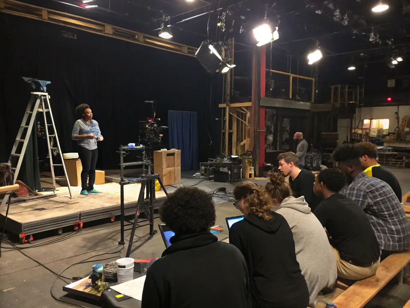 An inspiring image of a workshop where VOGUENT LES MOUETTES IN OLERON is teaching young people technical skills related to event production, emphasizing their commitment to skills transmission.